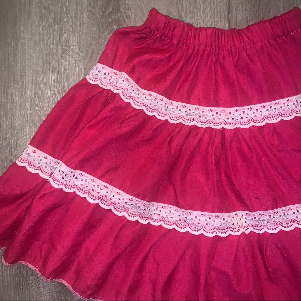 flowy pink mini skirt with lace trim